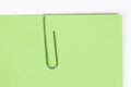 Paper clip holding on blank colour paper text Royalty Free Stock Photo