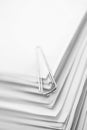 Paper clip on a stack of papers. Conceptual image Royalty Free Stock Photo