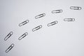 Paper clips like footprints on white background. Walk in Royalty Free Stock Photo