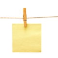 Paper with clothes peg over white