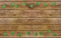 Paper clover leaves on the old wooden background. Lucky shamrock, St.Patrick`s day holiday symbol. Space for text, top view Royalty Free Stock Photo