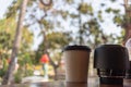 Paper coffee mugs filled with hot coffee are placed on the counter inside the coffee shop for the convenience of customers to take Royalty Free Stock Photo