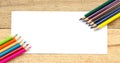 Paper and color pencils on table Royalty Free Stock Photo