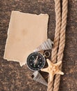 Paper, compass, rope and seashell