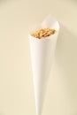 Paper cone with salted peanut isolated white background Sao Paulo Brazil Royalty Free Stock Photo