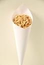 Paper cone with salted peanut isolated white background Sao Paulo Brazil Royalty Free Stock Photo