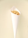 Paper cone with salted peanut isolated white background Sao Paulo Brazil Royalty Free Stock Photo