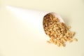 Paper cone with salted peanut white background Sao Paulo Brazil Royalty Free Stock Photo