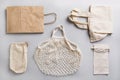 Paper, cotton and mesh bags for zero waste shopping on grey. Zero waste concept