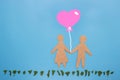 Paper couple with a balloon