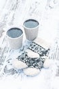 paper craft glass, cup with a hot drink, coffee, cocoa, mulled wine and white and black mittens Royalty Free Stock Photo