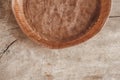 Paper craft plate with crumbs on vintage wooden background texture. Top view. Copy, empty space for text Royalty Free Stock Photo