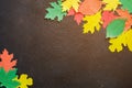 Paper craft, red and yellow Autumn leaves.Top view on flat lay on dark concrete background Royalty Free Stock Photo