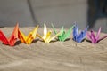 Paper cranes - origami colors of the LGBTQ flag. Flag of the LGBT community with paper cranes. Colored paper cranes - a