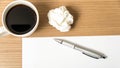 Paper and crumpled with pen and coffee cup Royalty Free Stock Photo