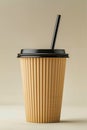 A paper cup with a black lid and a straw Royalty Free Stock Photo