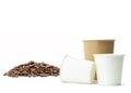 Paper cup with coffee beans on isolated white Royalty Free Stock Photo