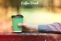 Paper cup of coffee outdoors, coffee break banner