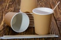 Paper cup for coffee. Wooden table