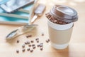 A paper cup of full roasted aroma coffee beans with blurred back Royalty Free Stock Photo