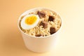 Paper cup with instant ramen noodles with beef and vegetables Royalty Free Stock Photo