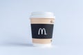 Paper cup of McDonald`s Coffee on white background.