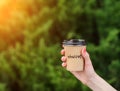 paper cup witn wrotten word on it Royalty Free Stock Photo