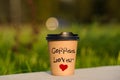 paper cup witn wrotten word on it Royalty Free Stock Photo