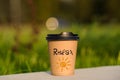 paper cup witn wrotten word on it Royalty Free Stock Photo