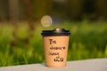 paper cup witn wrotten word on it Royalty Free Stock Photo