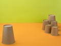 Paper cups in the bright orange and green background Royalty Free Stock Photo