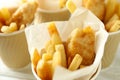 Paper cups with fried fish and chips, close up Royalty Free Stock Photo