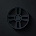 Paper cut Alloy wheel for a car icon isolated on black background. Paper art style. Vector