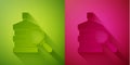 Paper cut Big bottle with clean water and magnifying glass icon isolated on green and pink background. Plastic container Royalty Free Stock Photo