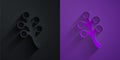 Paper cut Blossom tree branch with flowers icon isolated on black on purple background. Paper art style. Vector Royalty Free Stock Photo