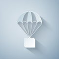 Paper cut Box flying on parachute icon isolated on grey background. Parcel with parachute for shipping. Delivery service