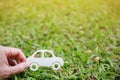 Paper cut of car on green grass background Royalty Free Stock Photo
