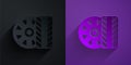 Paper cut Car tire wheel icon isolated on black on purple background. Paper art style. Vector