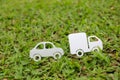 Paper cut of car and truck on green grass background Royalty Free Stock Photo