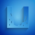 Paper cut Cemetery digged grave hole icon isolated on blue background. Paper art style. Vector Royalty Free Stock Photo