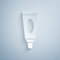 Paper cut Cream or lotion cosmetic tube icon isolated on grey background. Body care products for men. Paper art style. Vector