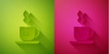 Paper cut Cup of tea with tea bag icon isolated on green and pink background. Paper art style. Vector Royalty Free Stock Photo