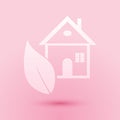 Paper cut Eco friendly house icon isolated on pink background. Eco house with leaf. Paper art style. Vector Royalty Free Stock Photo