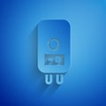 Paper cut Electric boiler for heating water icon isolated on blue background. Paper art style. Vector