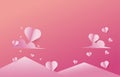 Paper cut elements in shape of heart flying on mountain pink and sweet background. Royalty Free Stock Photo