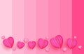 Paper cut elements in shape of heart flying on pink and sweet background. Royalty Free Stock Photo