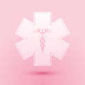 Paper cut Emergency star - medical symbol Caduceus snake with stick icon isolated on pink background. Star of Life Royalty Free Stock Photo