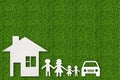 Paper cut of family on green grass Royalty Free Stock Photo