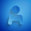 Paper cut Gamepad of time icon isolated on blue background. Time to play games. Game controller. Paper art style. Vector Royalty Free Stock Photo