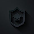 Paper cut Graduation cap with shield icon isolated on black background. Insurance concept. Security, safety, protection